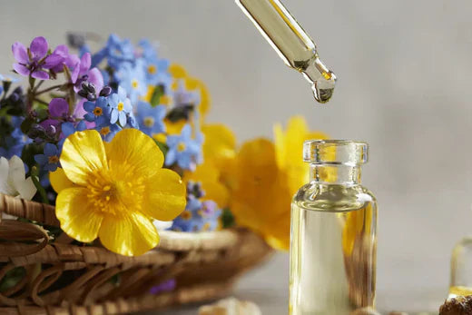 Design and create the perfect serum for your skin, dropper with oil dropping into bottle with a flower posie in basket