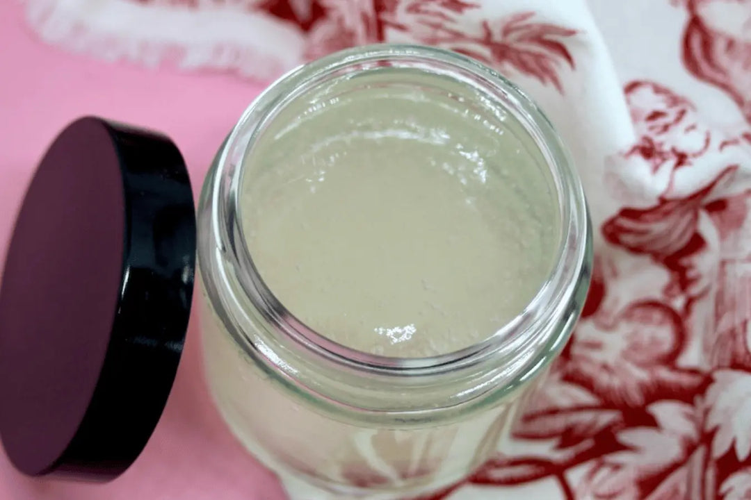 Homemade Gentle gel cleanser Go Native NZ skincare recipe in glass pot on pink cotton fabric