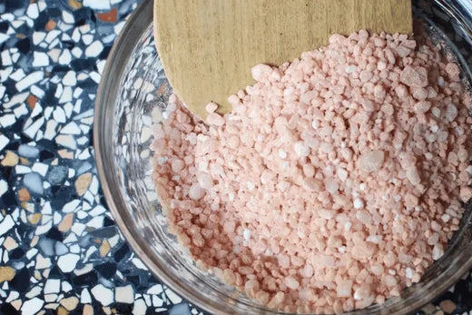Go Native New Zealand Luxurious Bath Salts Recipe - dusky pink colour and ingredients in a bowl with wooden sppon