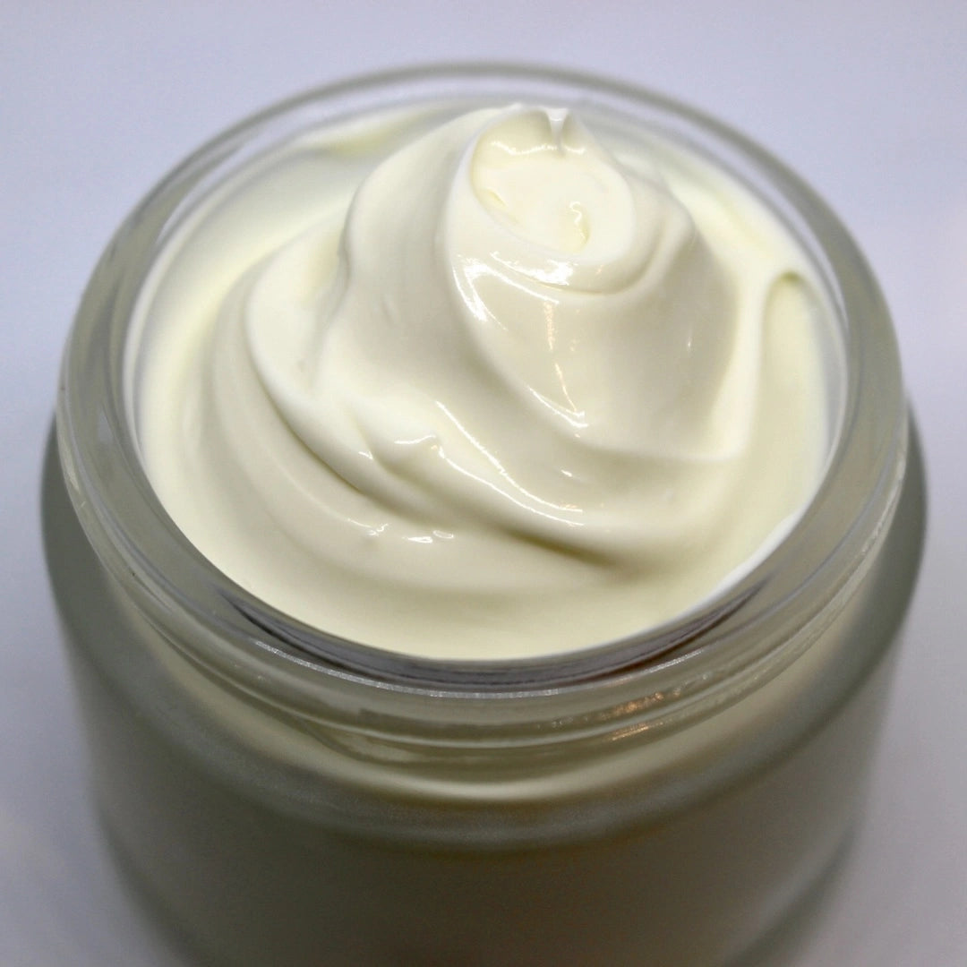 A close-up of Go Native NZ’s Certified Organic Rich Cream base, shown in a glass jar with a smooth, luxurious swirl of thick, white cream
